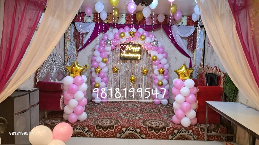 Pink anniversary arch stage